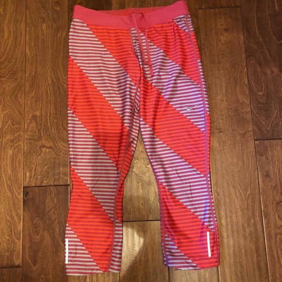 Nike Pants - Nike cropped leggings orange and red striped sz M Nike Pants - Nike cropped leggings orange and red striped sz M